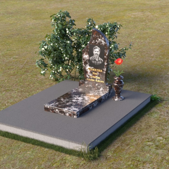 Памятник — стела с асимметричной линией из гранита, гранит амфиболит