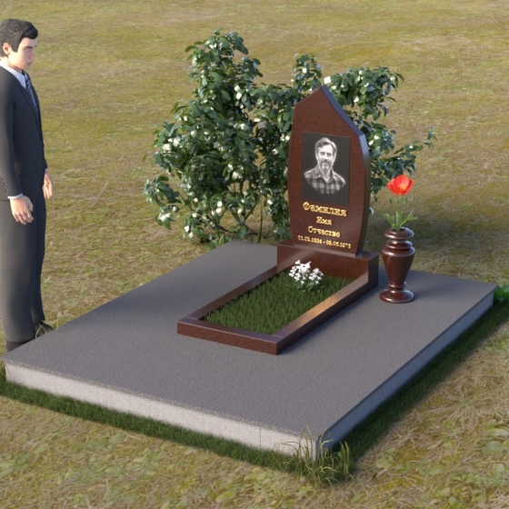 Памятник — стела в форме пламени из гранита